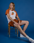 Produce Raglan Tee in Habanero worn by Grant