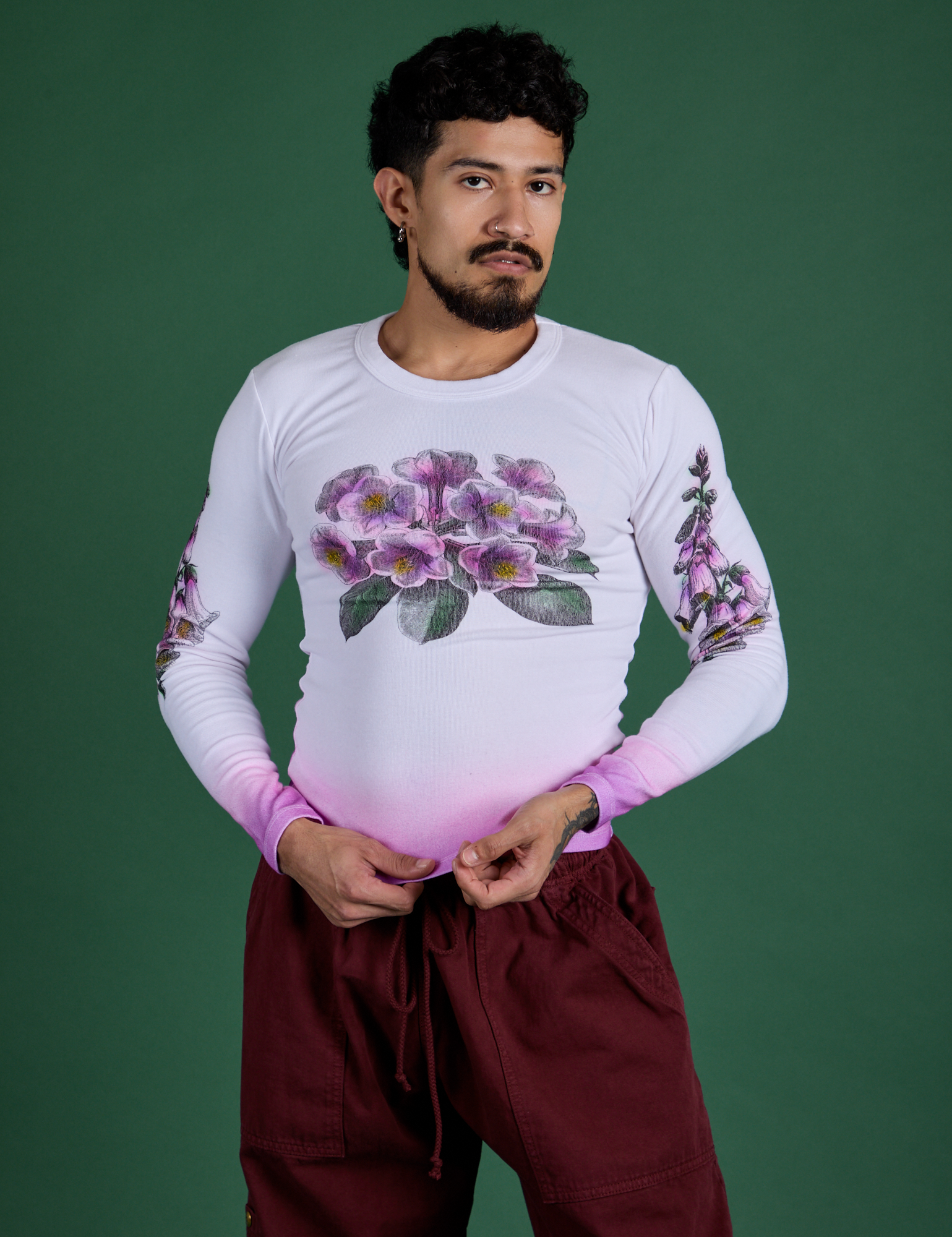 Jesse is wearing Floral Long Sleeve Baby Tee in Pink