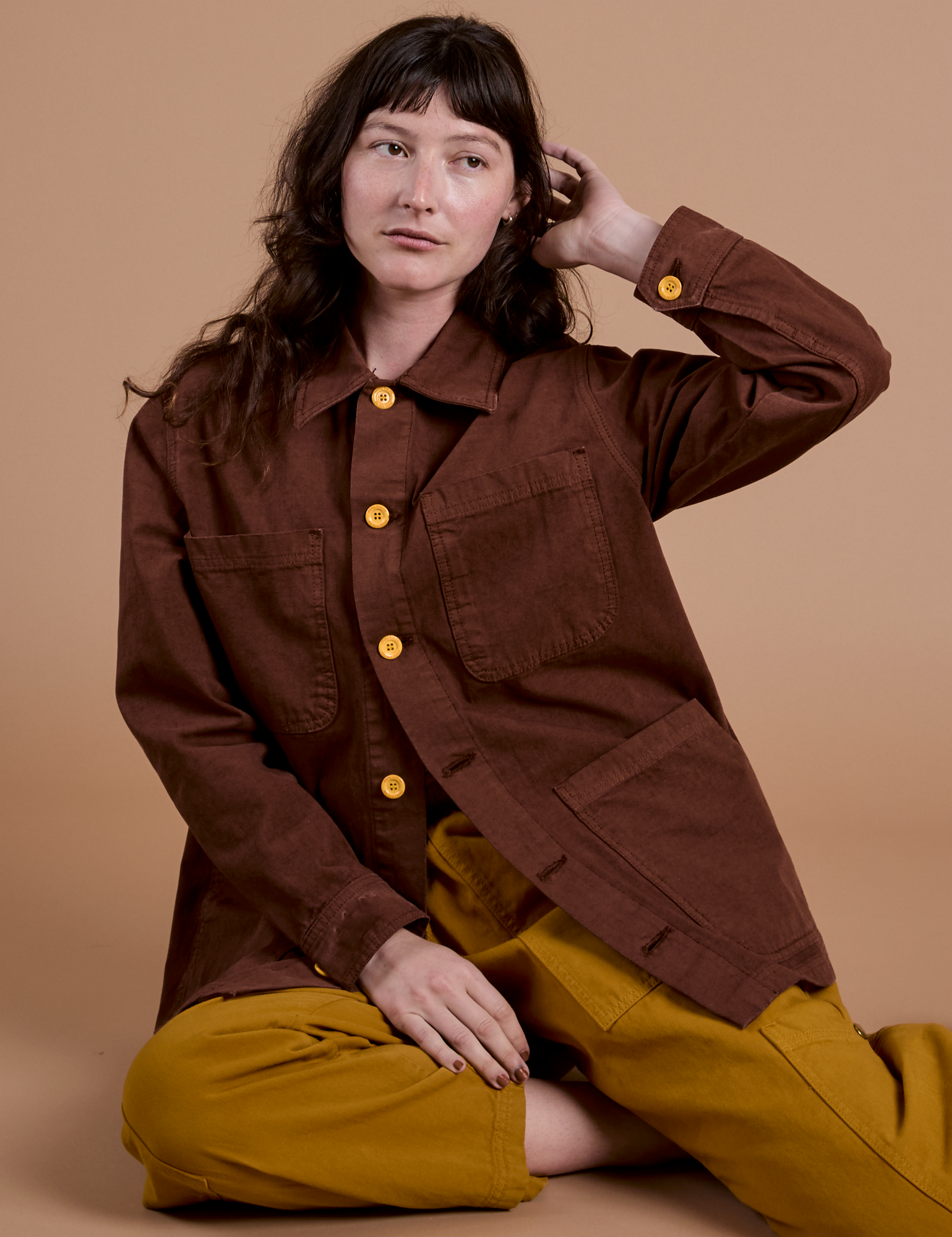 Alex is wearing Ripstop Field Coat in Fudgesicle Brown