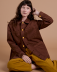 Alex is wearing Ripstop Field Coat in Fudgesicle Brown