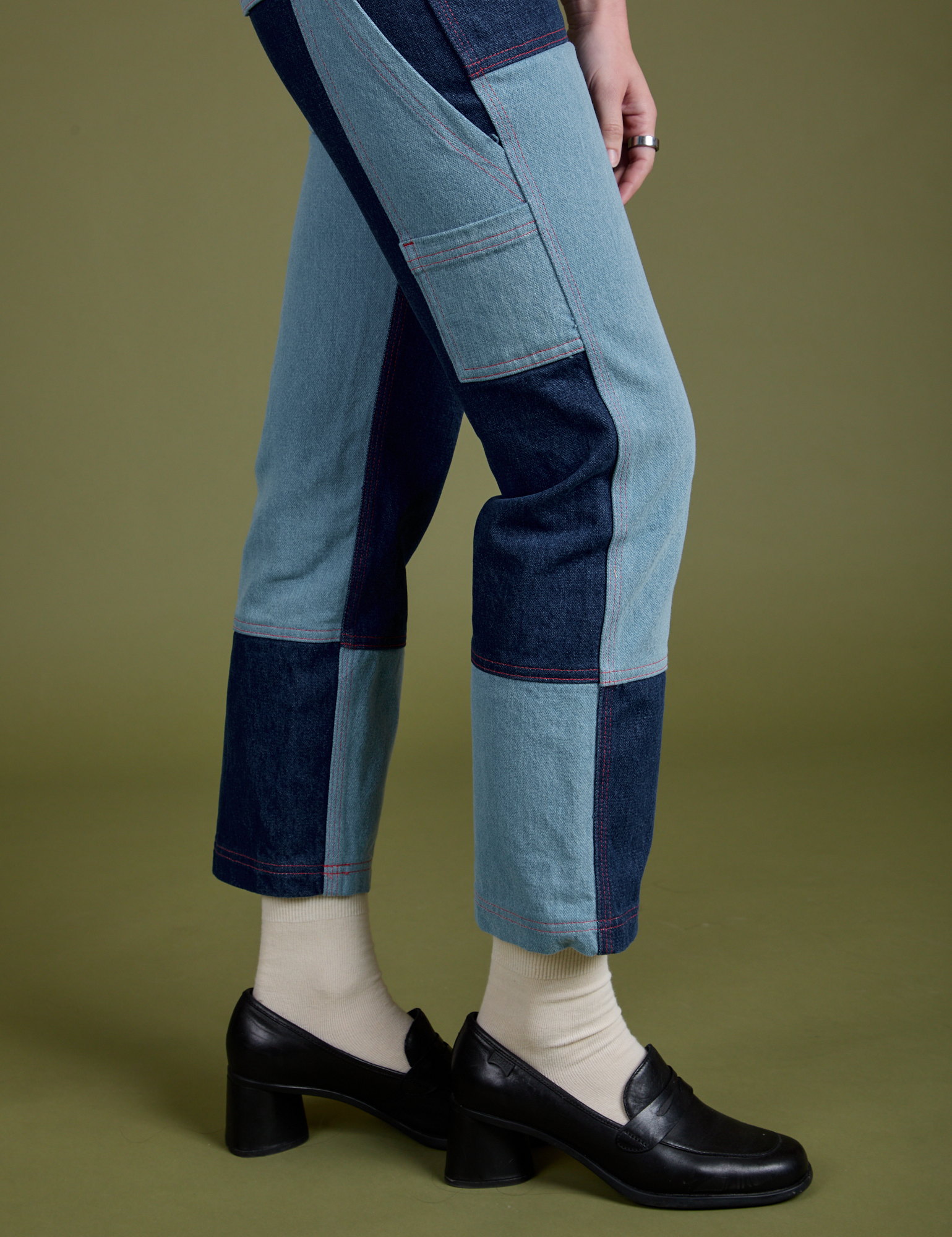 Pant leg side view close up of Mismatched Denim Carpenter Jeans on Alex