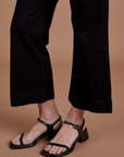 Action Pants in Basic Black pant leg close up on Alex