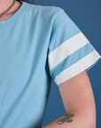 Painted Burly Tee in Baby Blue sleeve close up with two white painted stripes