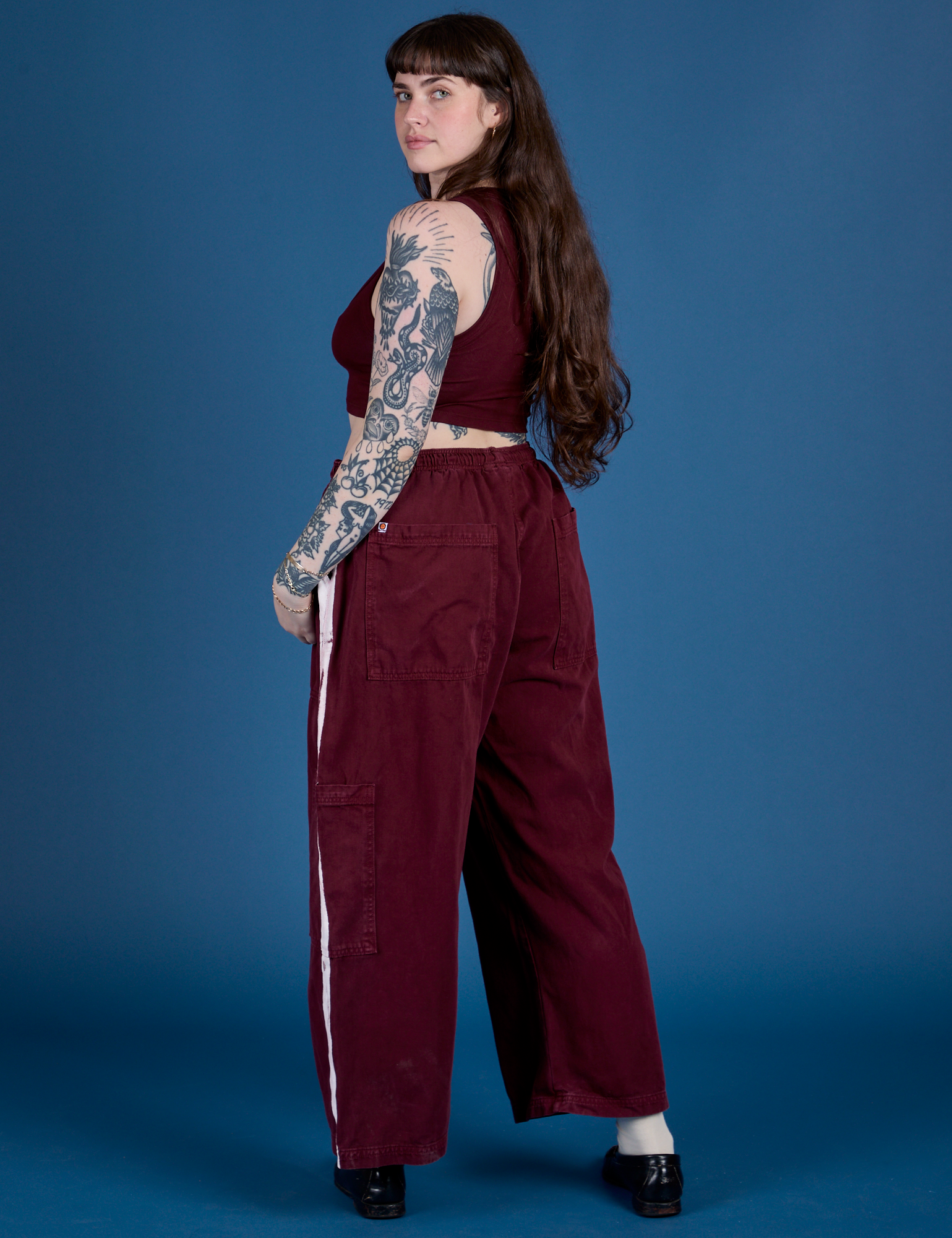 Painted Drop Pocket Cargo Pants in Red Wine angled back view on Sydney