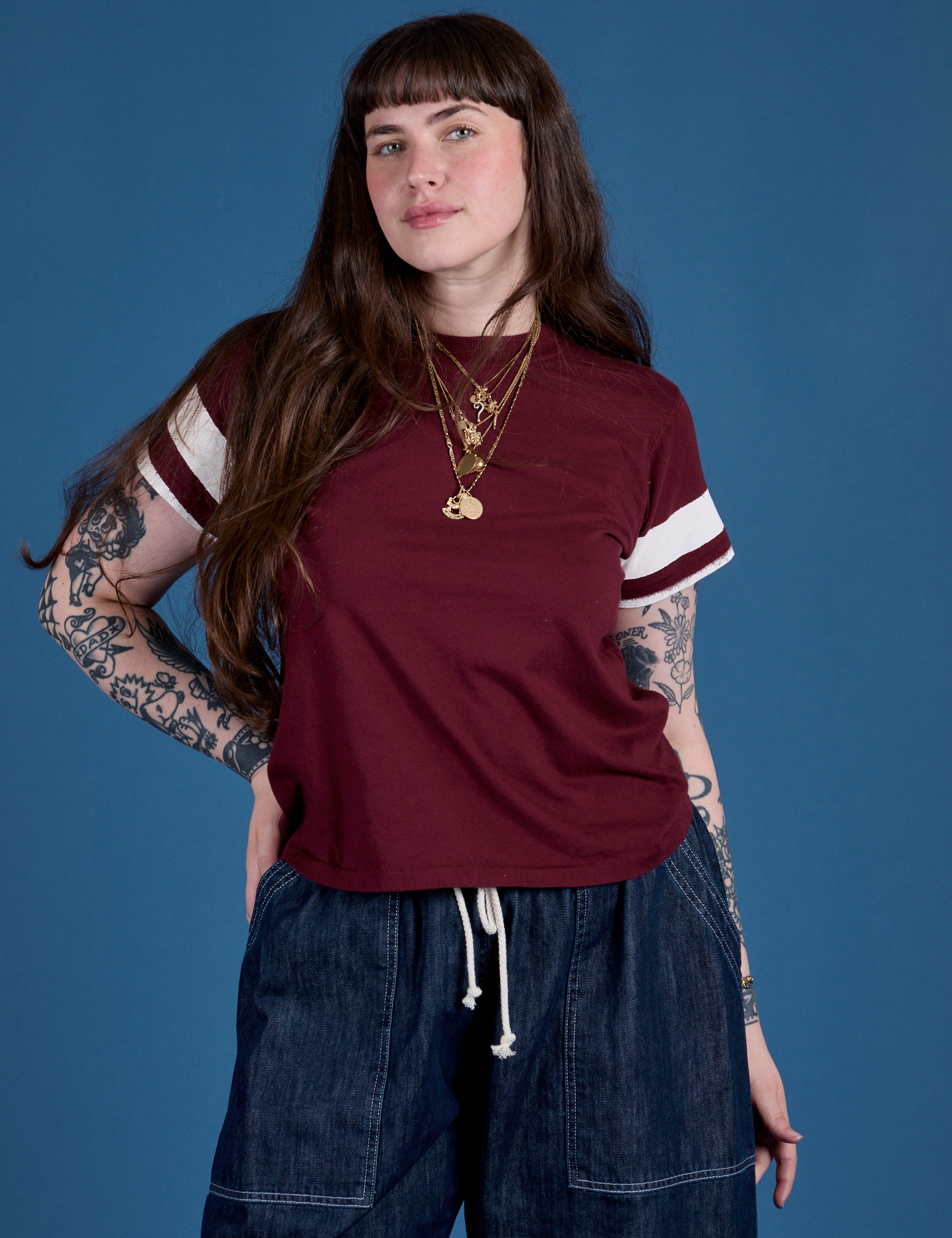 Sydney is 5’9” and wearing XXS Painted Vintage Tee in Red Wine