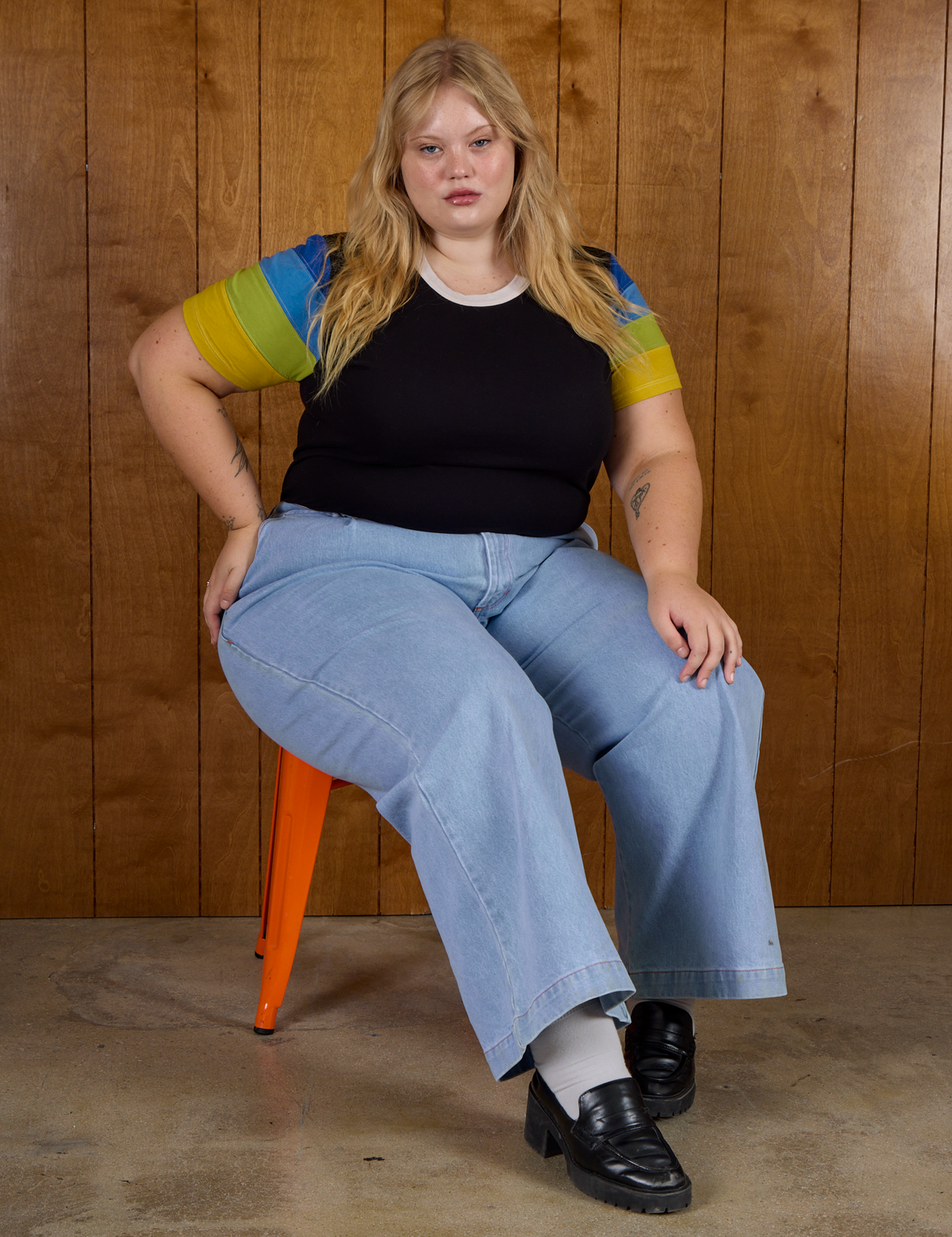Calypso Tee in Black Multi and light wash denim wide leg trousers on Juliet