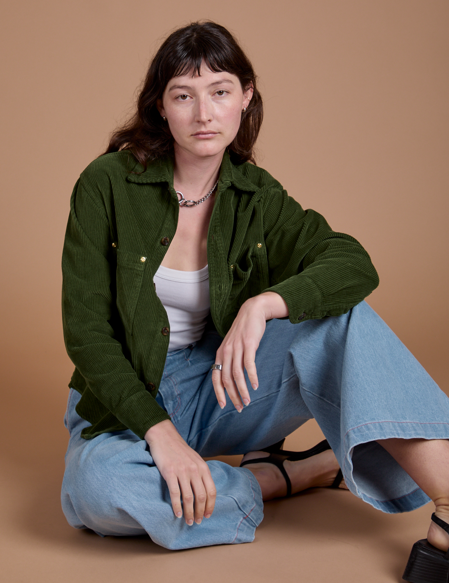 Alex has on the Cropped Corduroy Overshirt in Evergreen