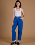 Alex is wearing Heritage Trousers in Royal Blue and vintage tee white Cropped Tank