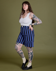 Angled front view of Longline Work Shorts in Cornflower and vintage tee white Cropped Tank on Sydney