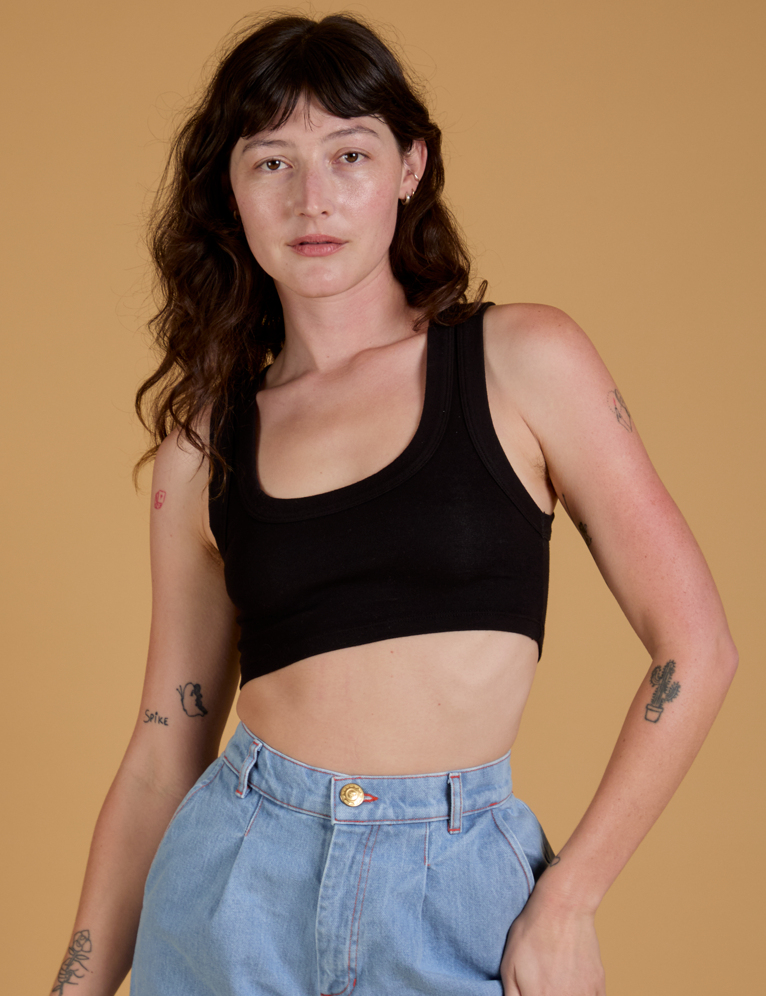 Alex is 5’8” and wearing P Mini Tank in Basic Black