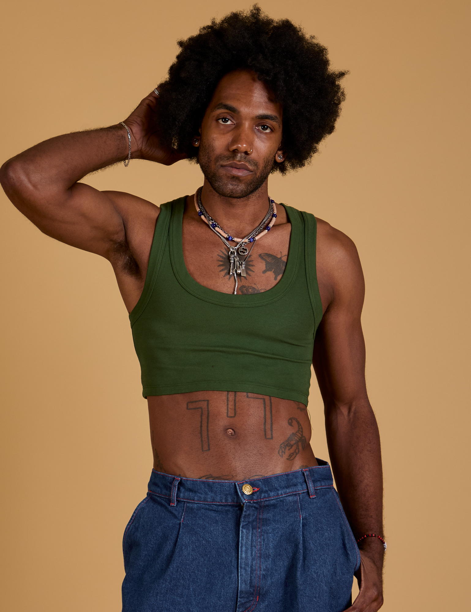 Jerrod is 6’3” and wearing S Mini Tank in Evergreen