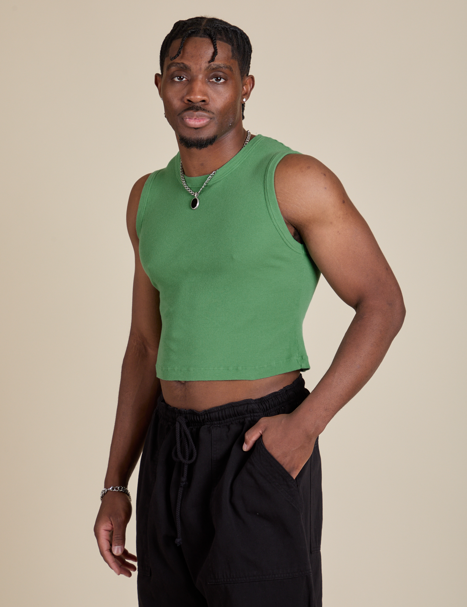 Angled front view of Muscle Tee in Seafoam Green on Isaac