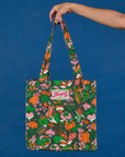 Kitchen Collection Printed Shopper Tote held up by model
