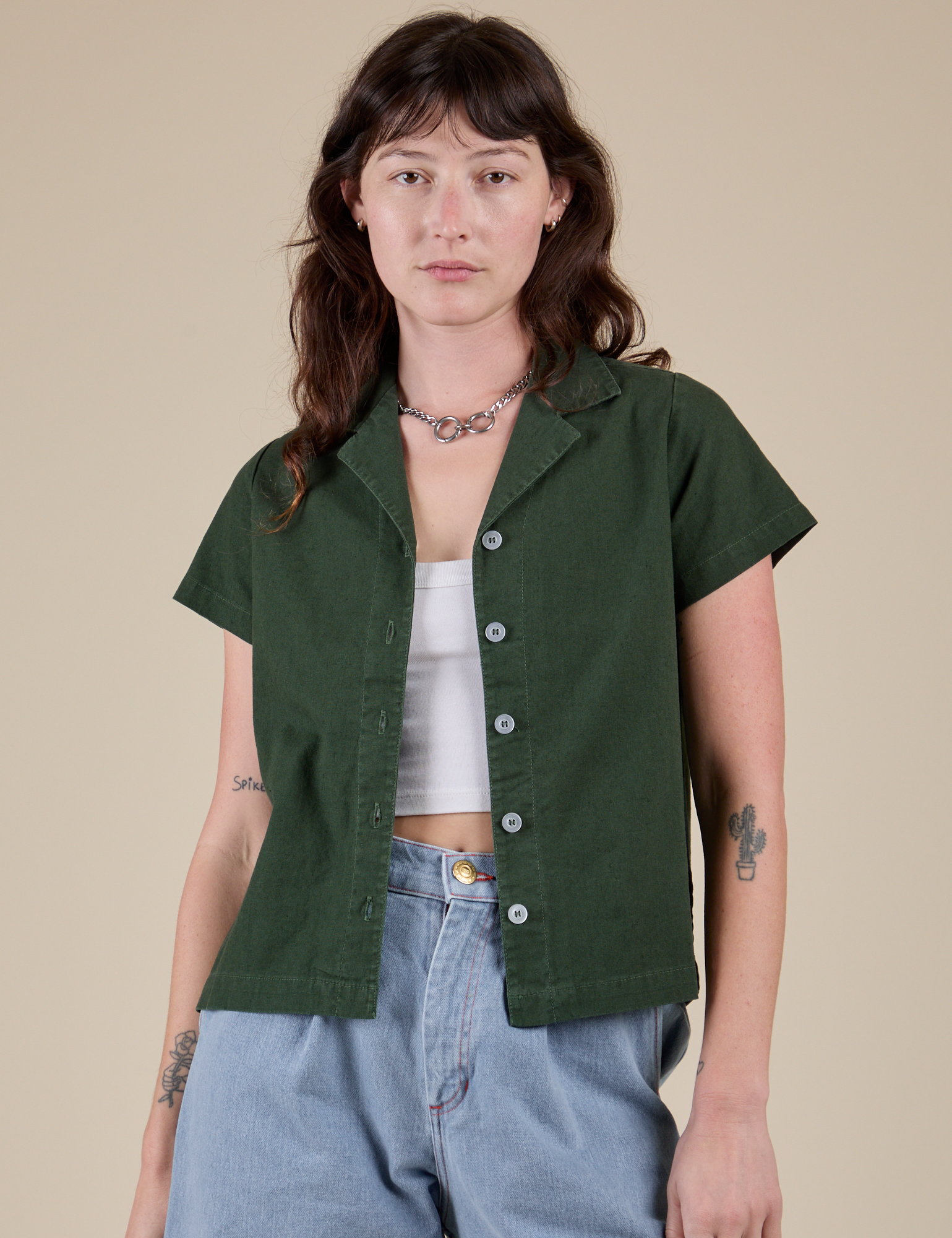 Alex is 5’8” and wearing P Pantry Button-Up in Swamp Green