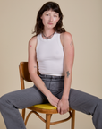 Alex is wearing Racerback Tank in Vintage Tee White and washed grey Work Pants