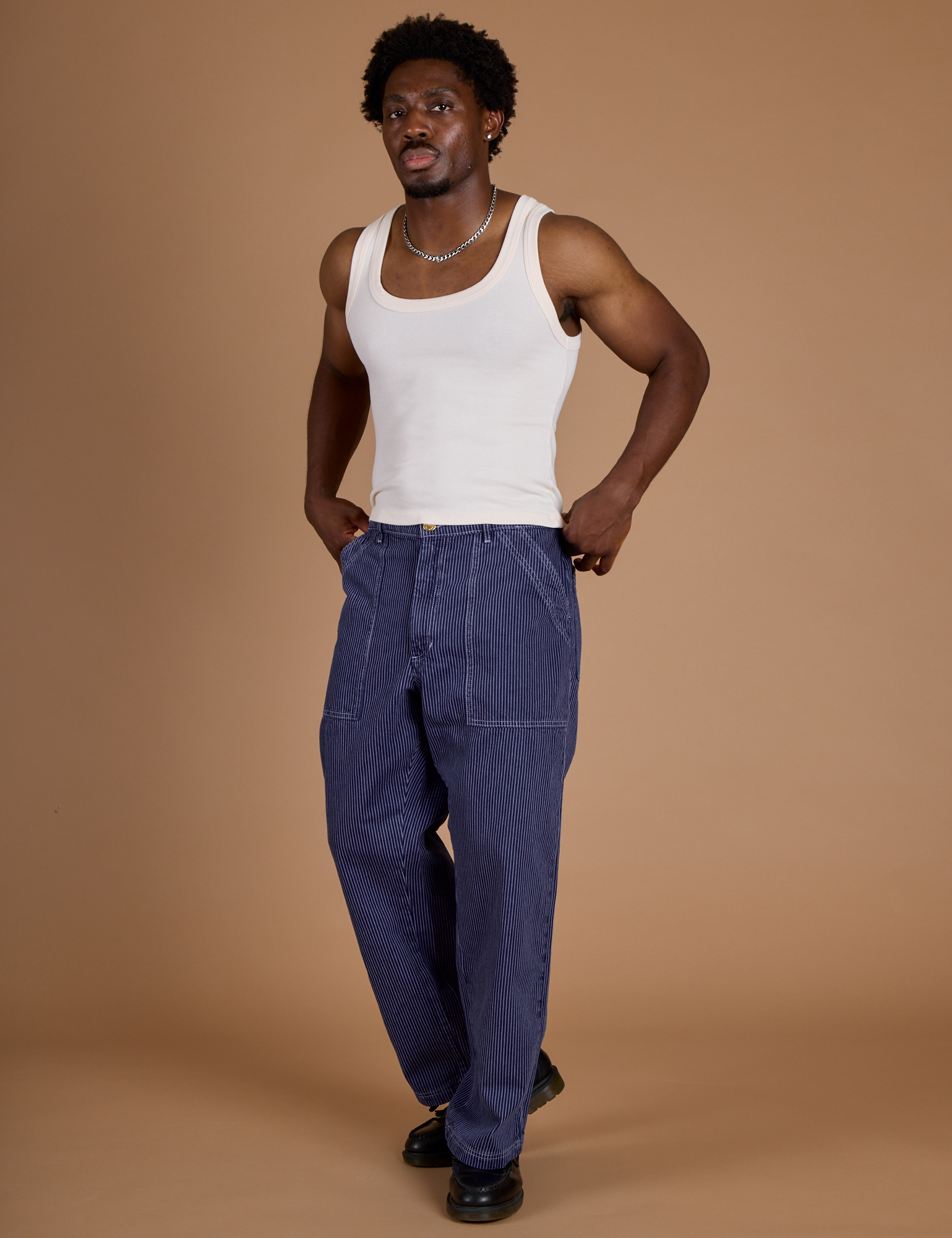 Railroad Denim Work Pants in Faded Grape Overdye and vintage tee off-white Tank Top on Isaac