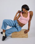 Cropped Tank Top in Baby Pink and light wash Denim Drop Pocket Pants worn by Kira