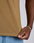 Jr. Varsity Tee in Desert Brown close up on Isaac