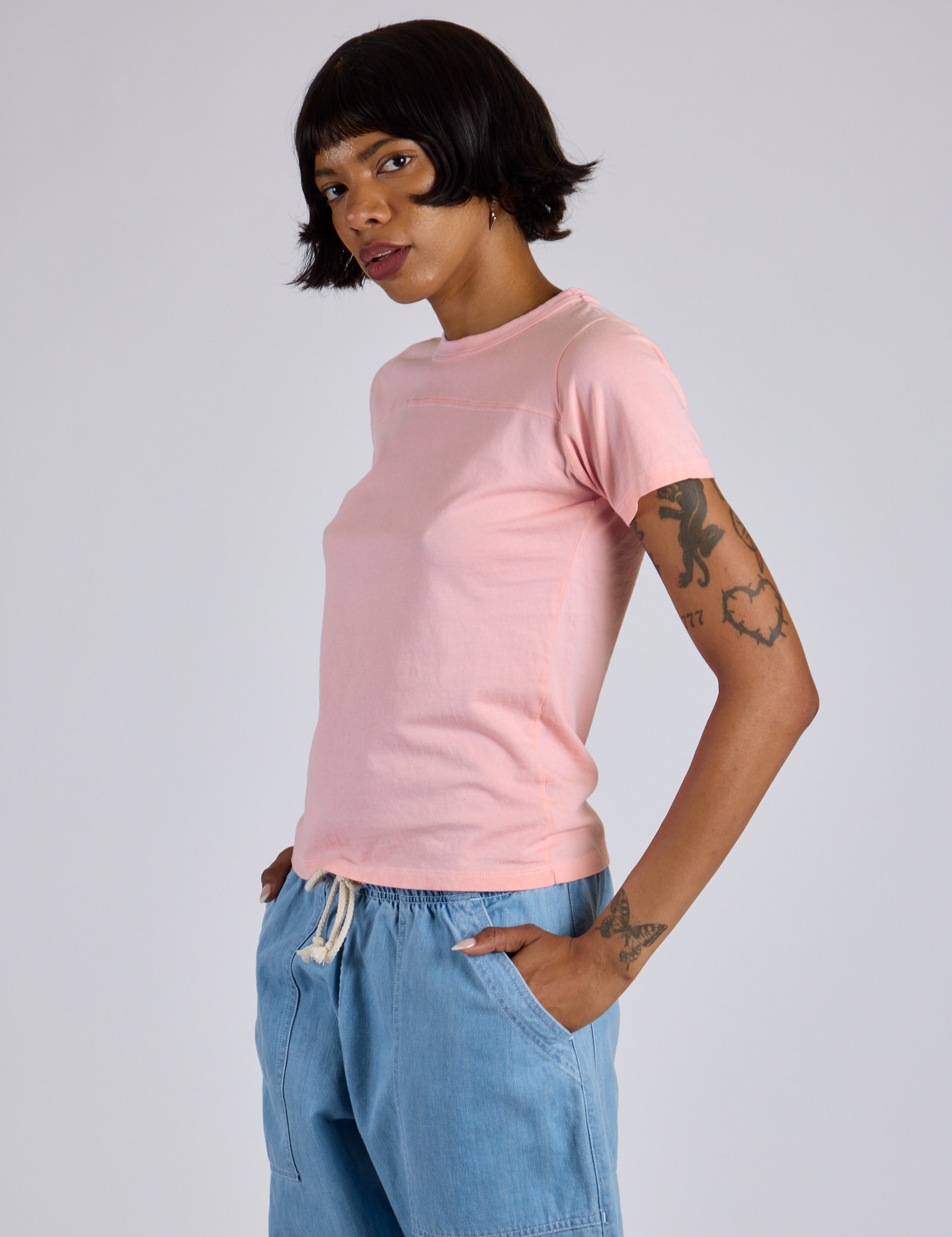 Jr. Varsity Tee in Baby Pink angled front view on Kira