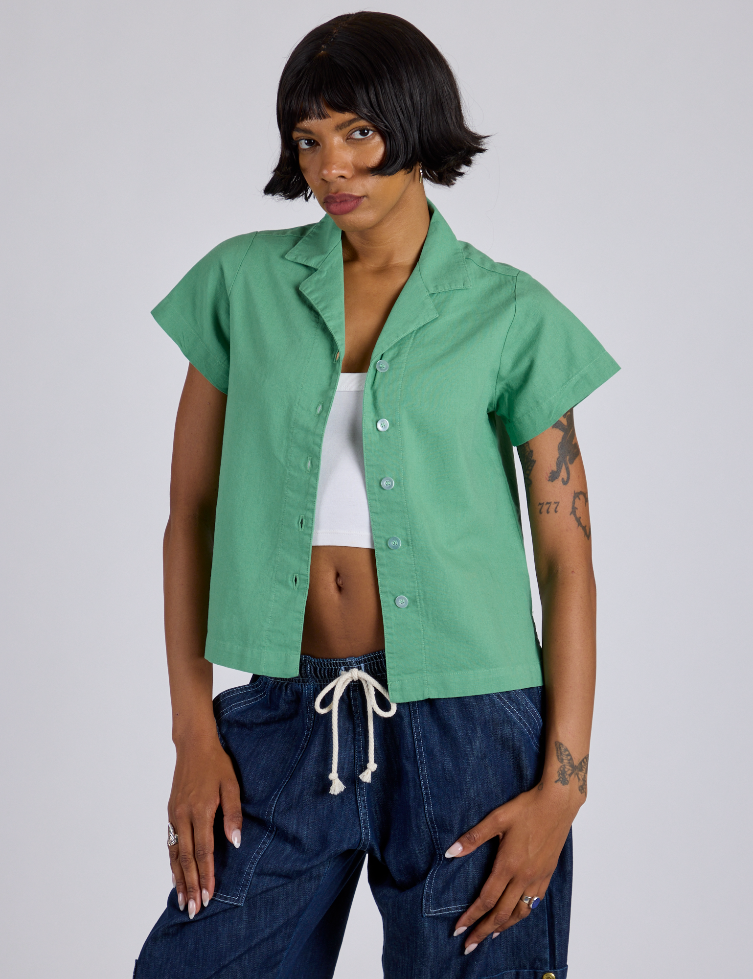 Kira is wearing Pantry Button-Up in Seafoam Green