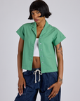 Kira is wearing Pantry Button-Up in Seafoam Green