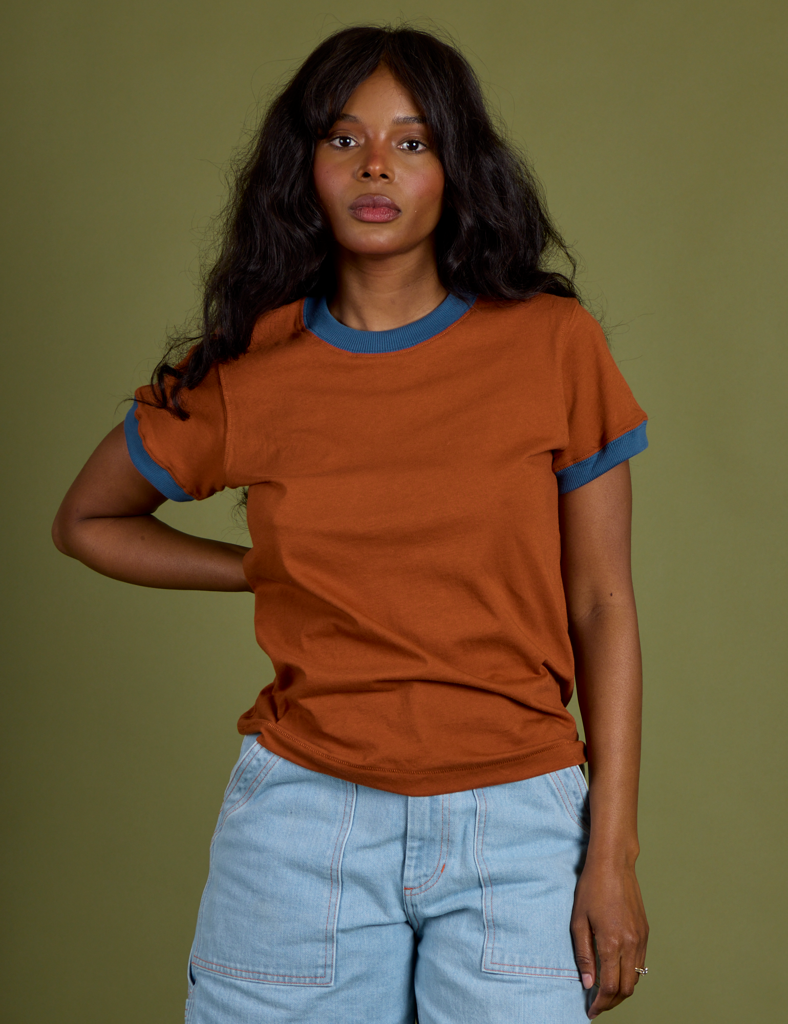 Kandia is 5’3” and wearing P Vintage Ringer Tee in Burnt Terracotta