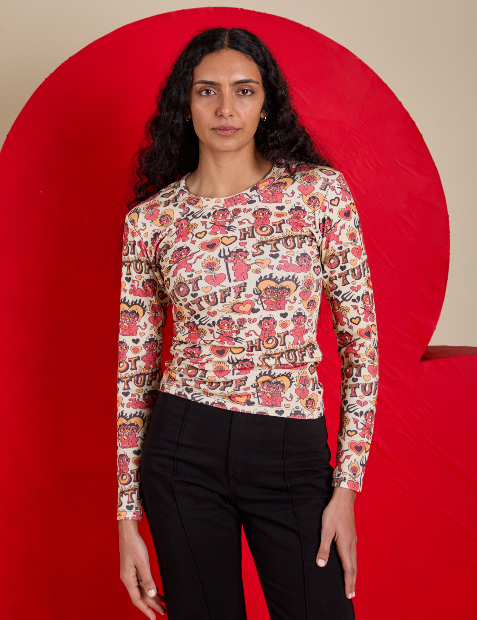 Shahana is 5’10 and wearing P Long Sleeve Baby Tee in Hot Stuff Print