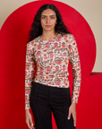 Shahana is 5’10 and wearing P Long Sleeve Baby Tee in Hot Stuff Print