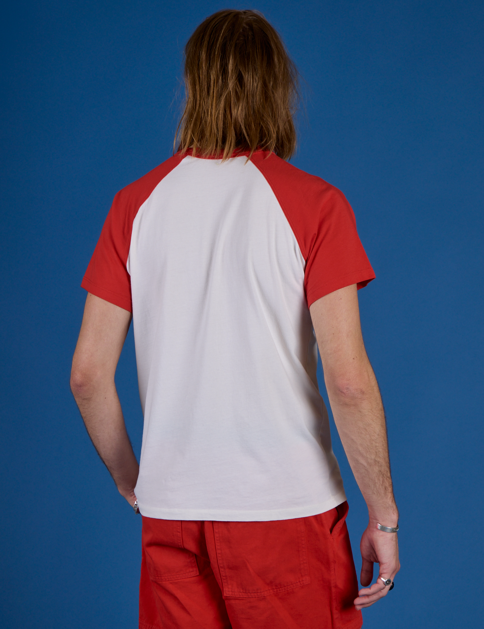 Back view of Produce Raglan Tee in Tomato on Grant