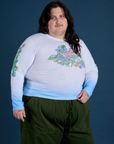 Angled front view of Floral Long Sleeve Baby Tee in Baby Blue on Sam