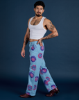 Side view of Floral Painted Work Pants in Blue and Cropped Tank in Vintage Tee White