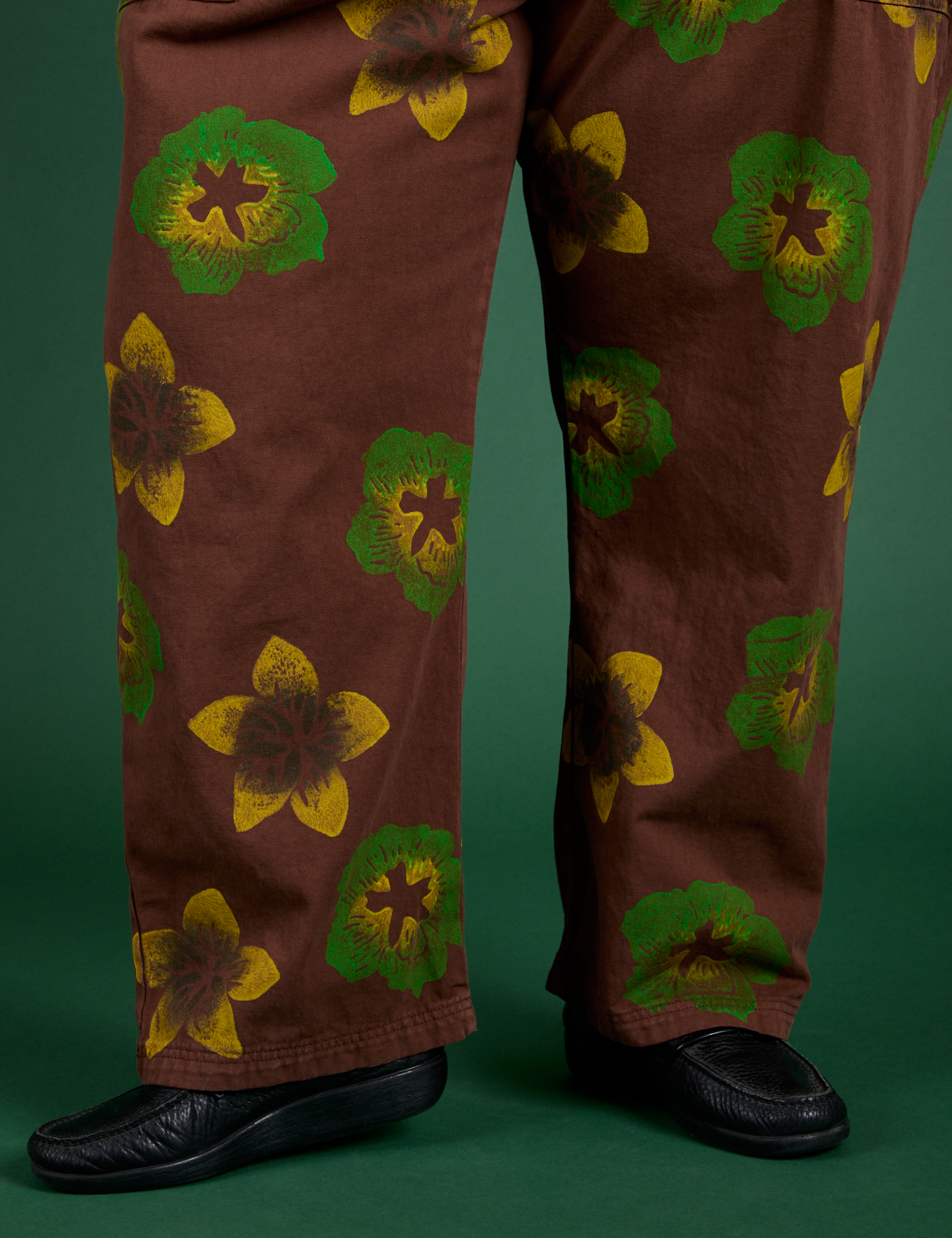 Floral Painted Work Pants in Brown pant leg close up on Sam