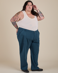 Angled front view of Work Pants in Lagoon and Tank Top in Vintage Tee Off-White on Sam
