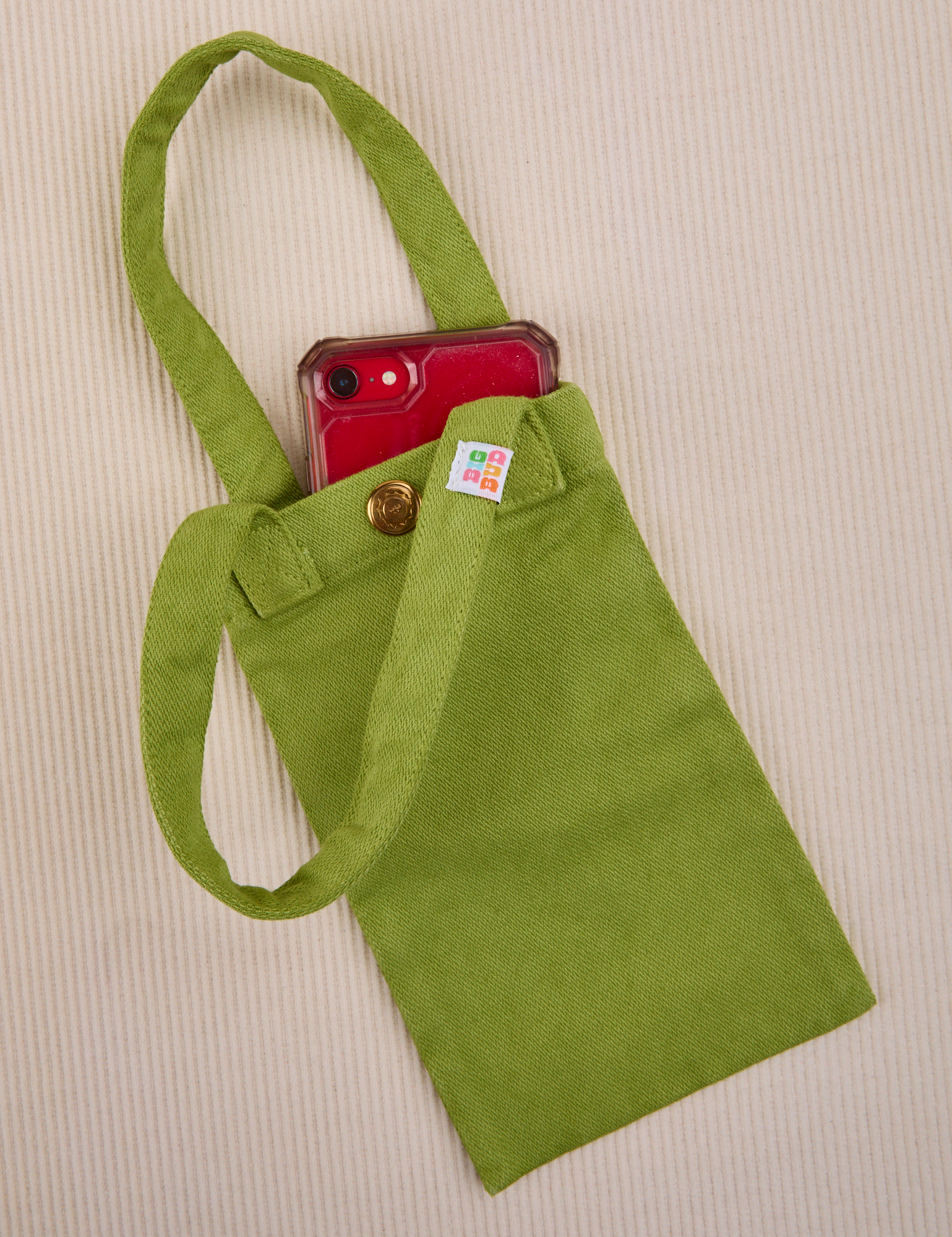Phone tucked into gross green Cell Phone Tote