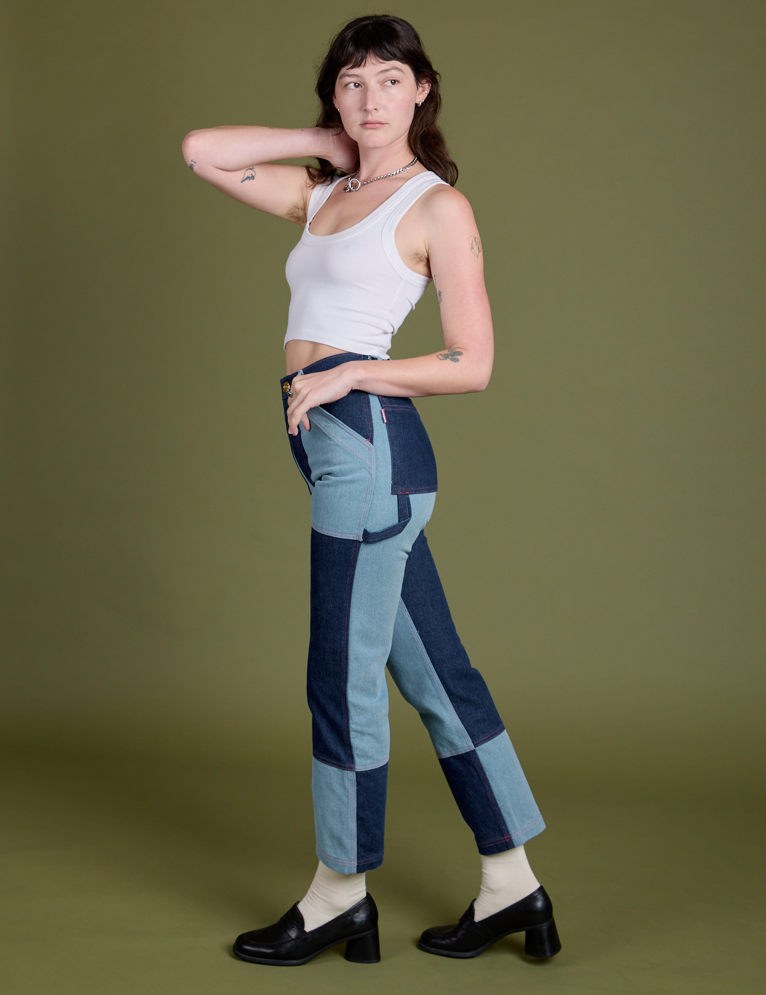 Side view of Mismatched Denim Carpenter Jeans and Cropped Tank in Vintage Tee White on Alex