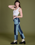 Side view of Mismatched Denim Carpenter Jeans and Cropped Tank in Vintage Tee White on Alex