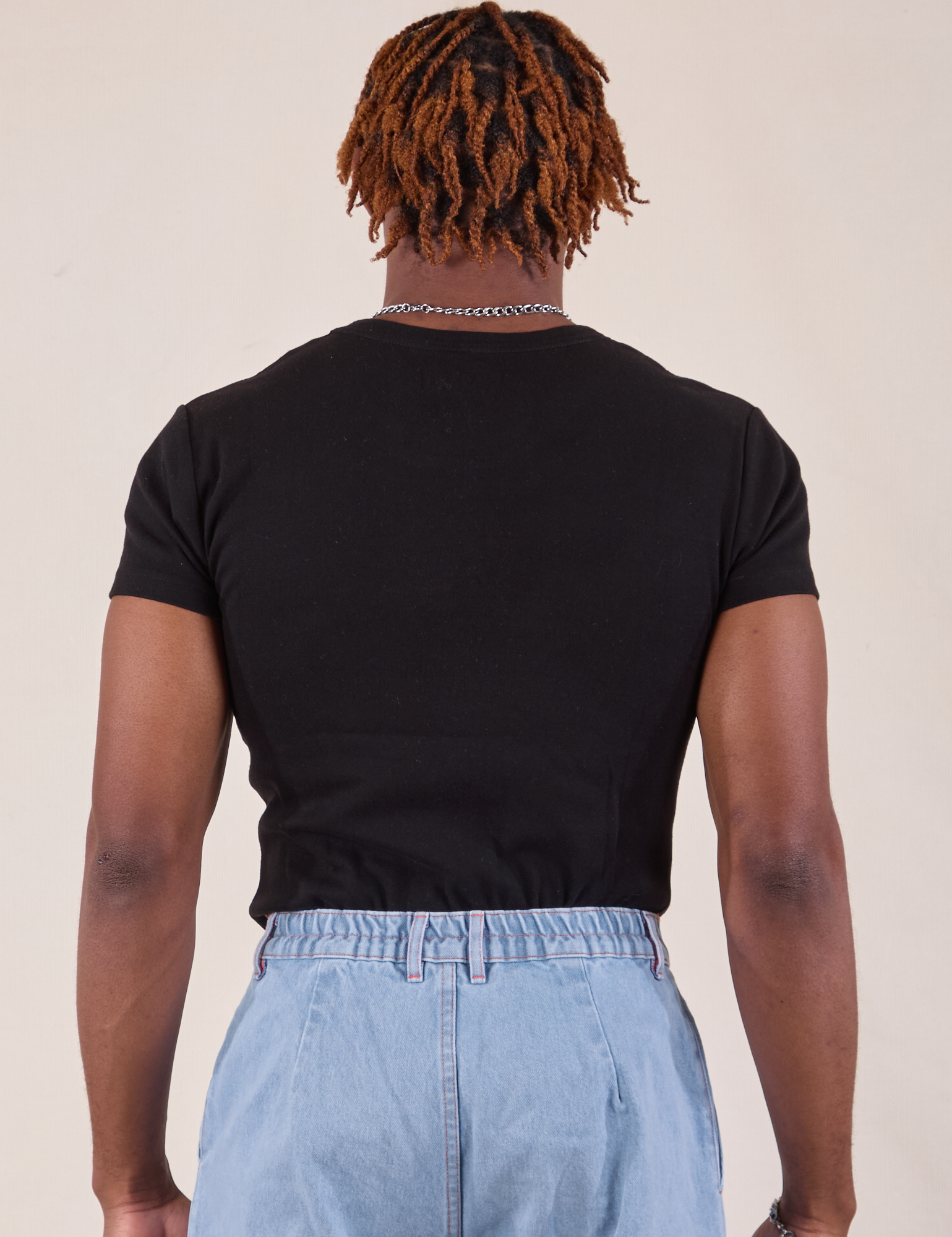 Baby Tee in Vintage Basic Black back view on Isaac