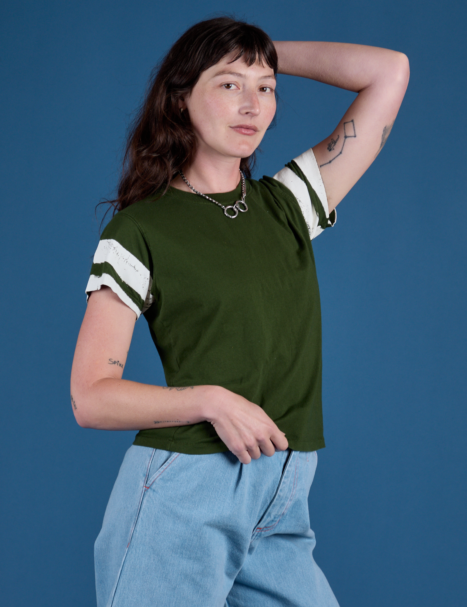 Angled front view of Painted Vintage Tee in Evergreen on Alex