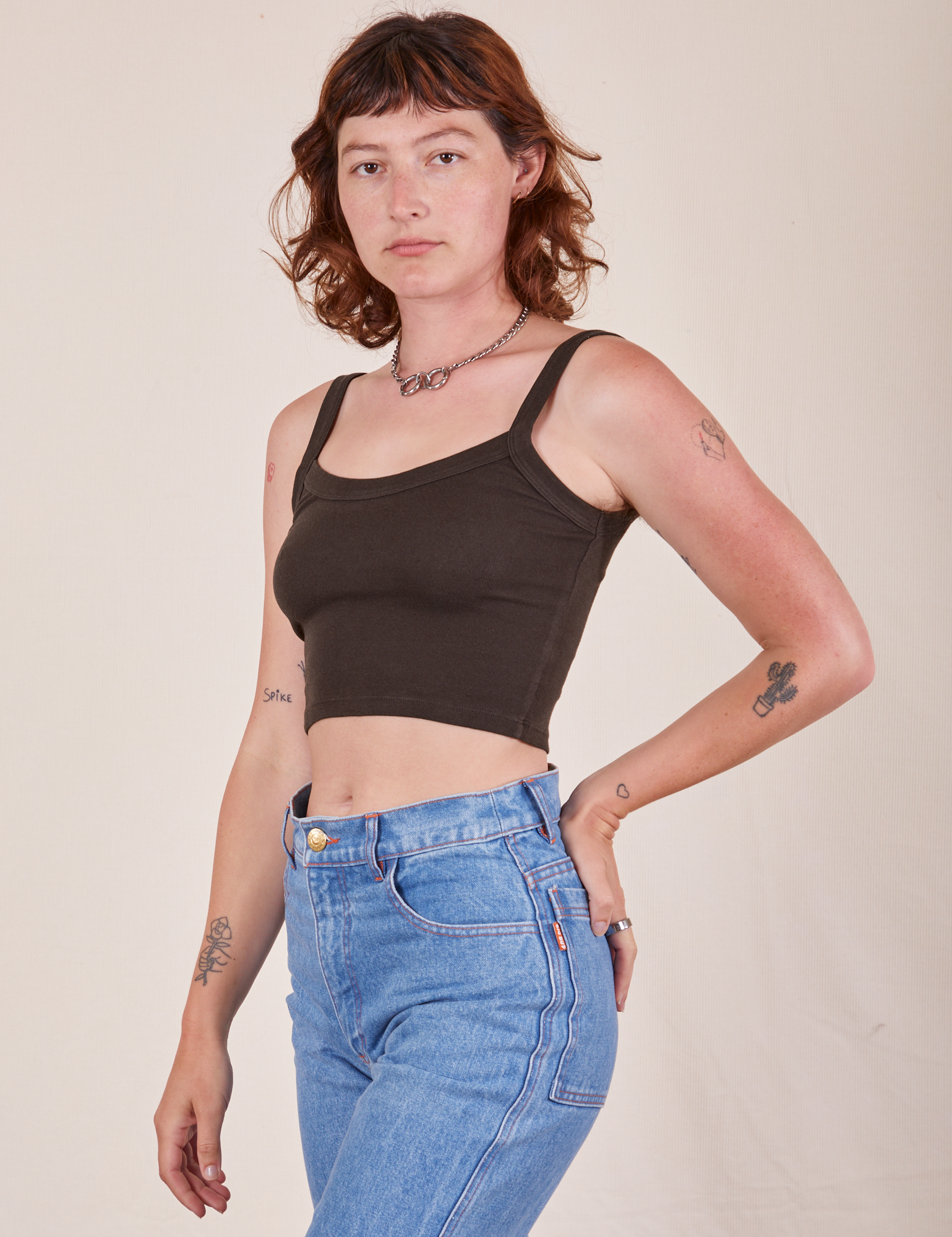 Angled view of Cropped Cami in Espresso Brown and light wash Frontier Jeans worn by Alex