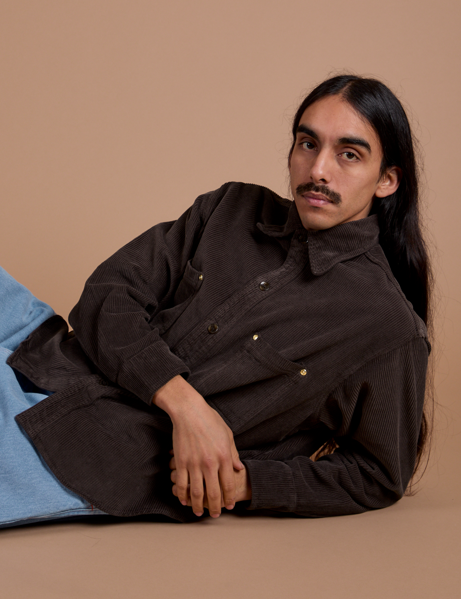 Anthony has on the Cropped Corduroy Overshirt in Espresso Brown