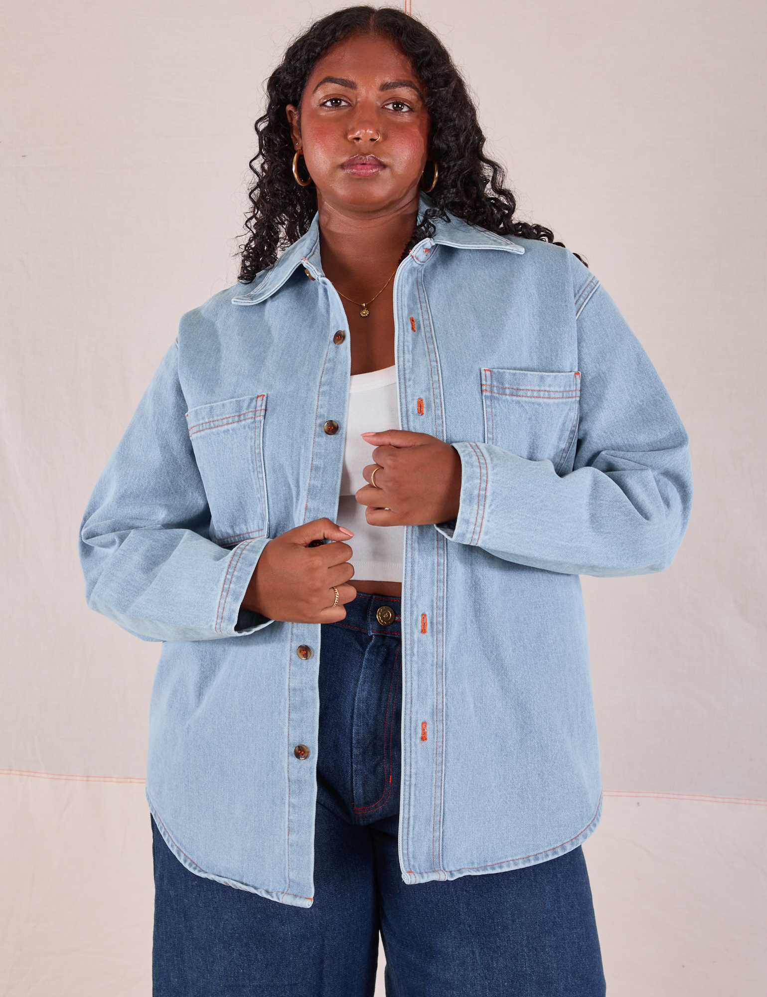 Meghna is 5'7" and wearing XS Denim Overshirt in Light Wash