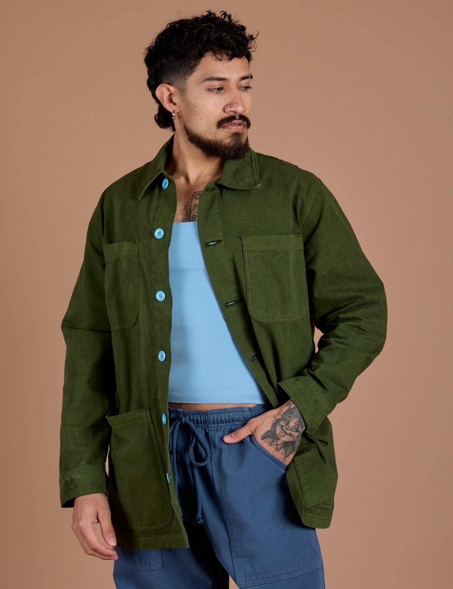 Jesse is 5'8" and wearing XS Ripstop Field Coat in Evergreen