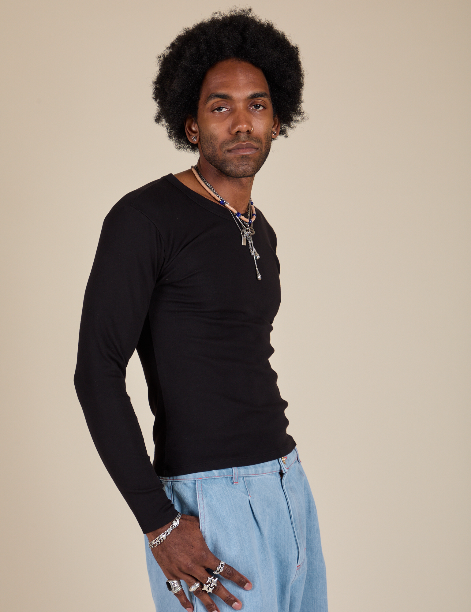 Long Sleeve Baby Tee in Basic Black side view on Jerrod