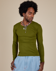Jerrod is 6’3” and wearing S Long Sleeve Baby Tee in Summer Olive