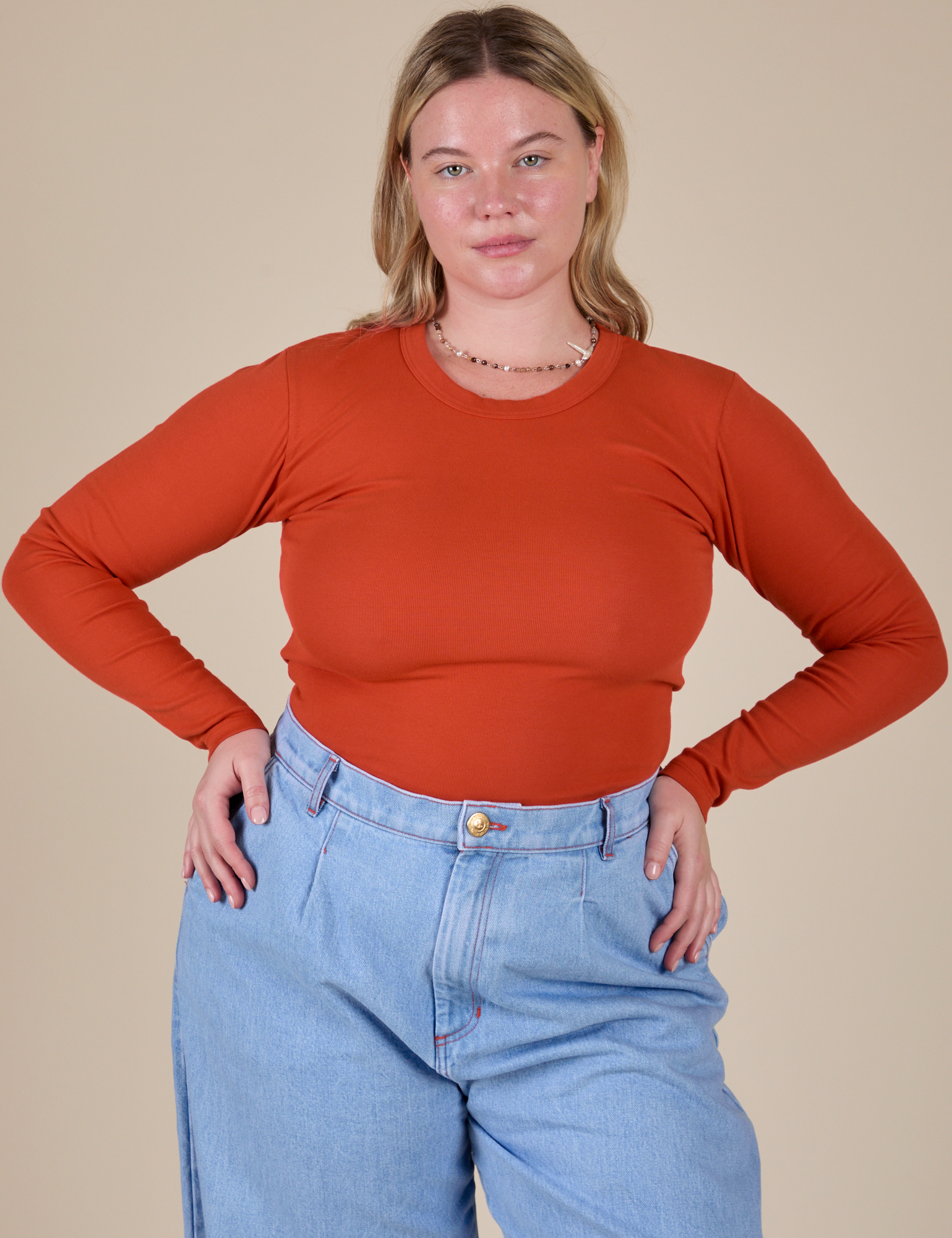 Lish is 5’8” and wearing XS Long Sleeve Baby Tee in Chili Red 