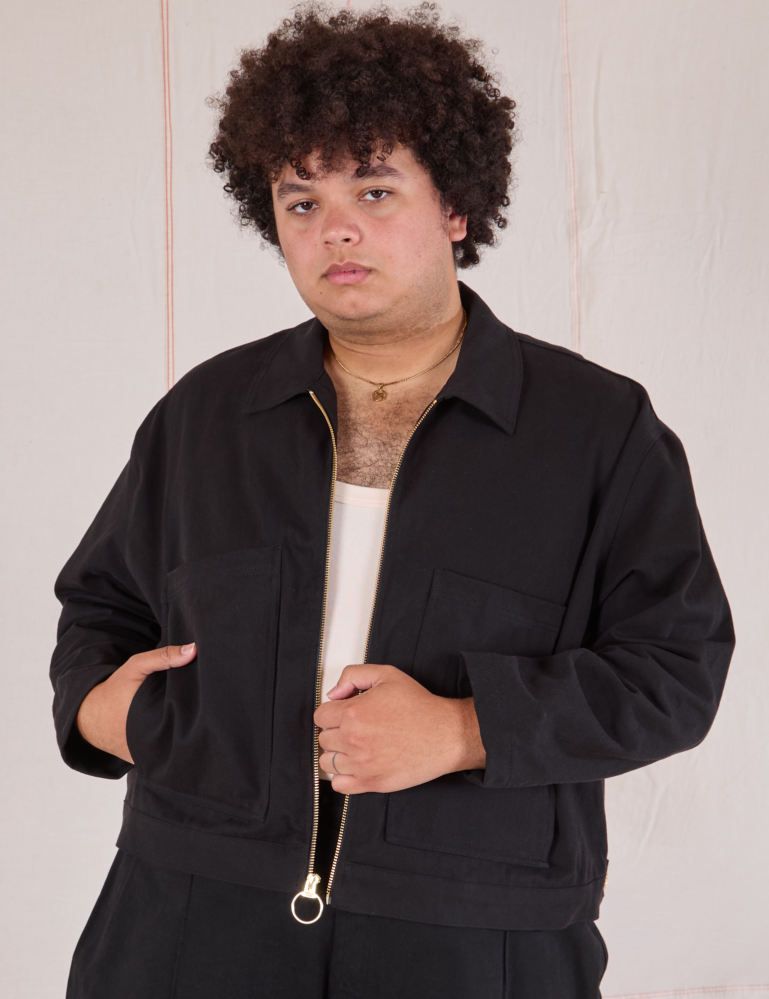 Miguel is wearing Mechanic Jacket in Basic Black