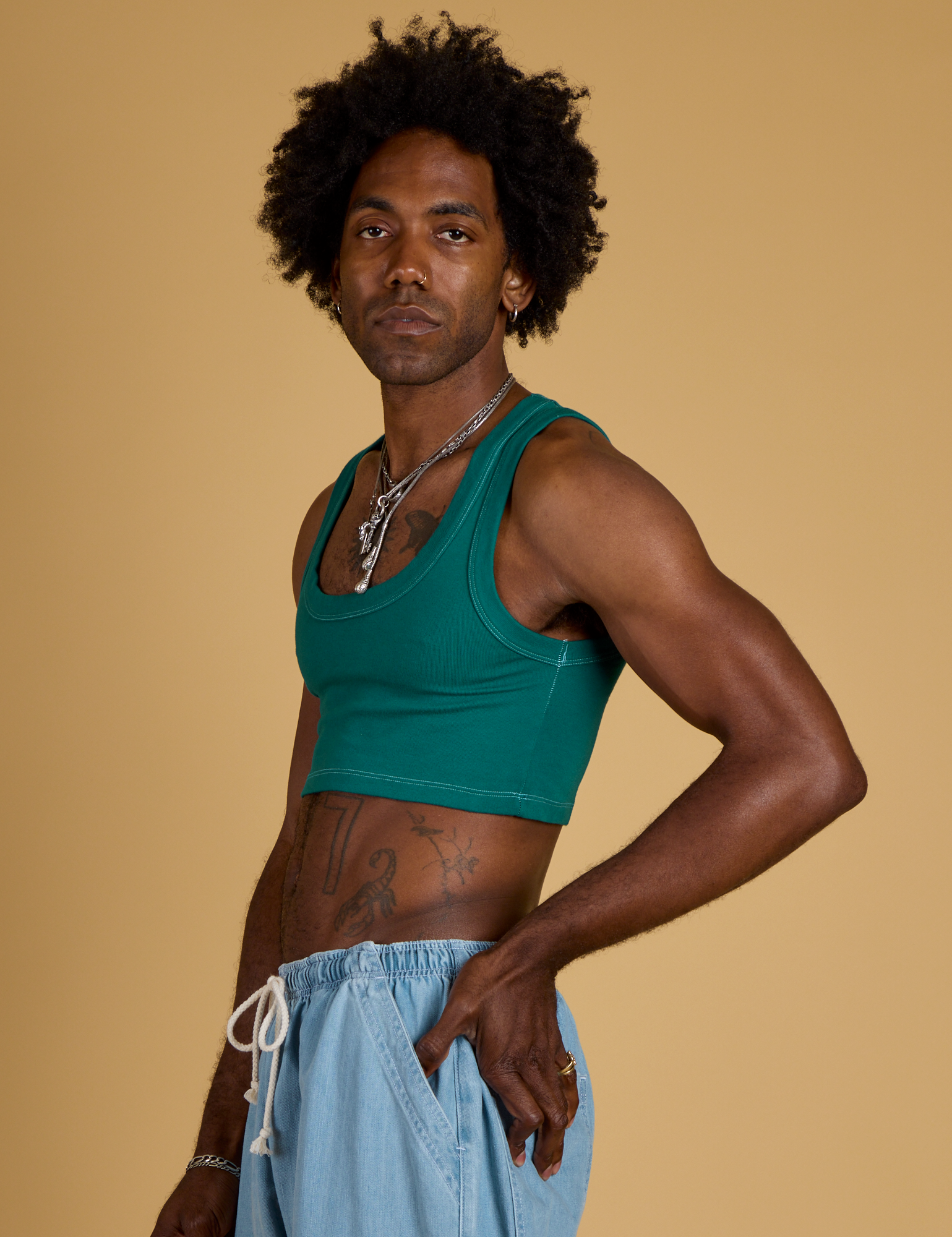 Contrast Stitch Mini Tank in Hunter Green side view on Jerrod