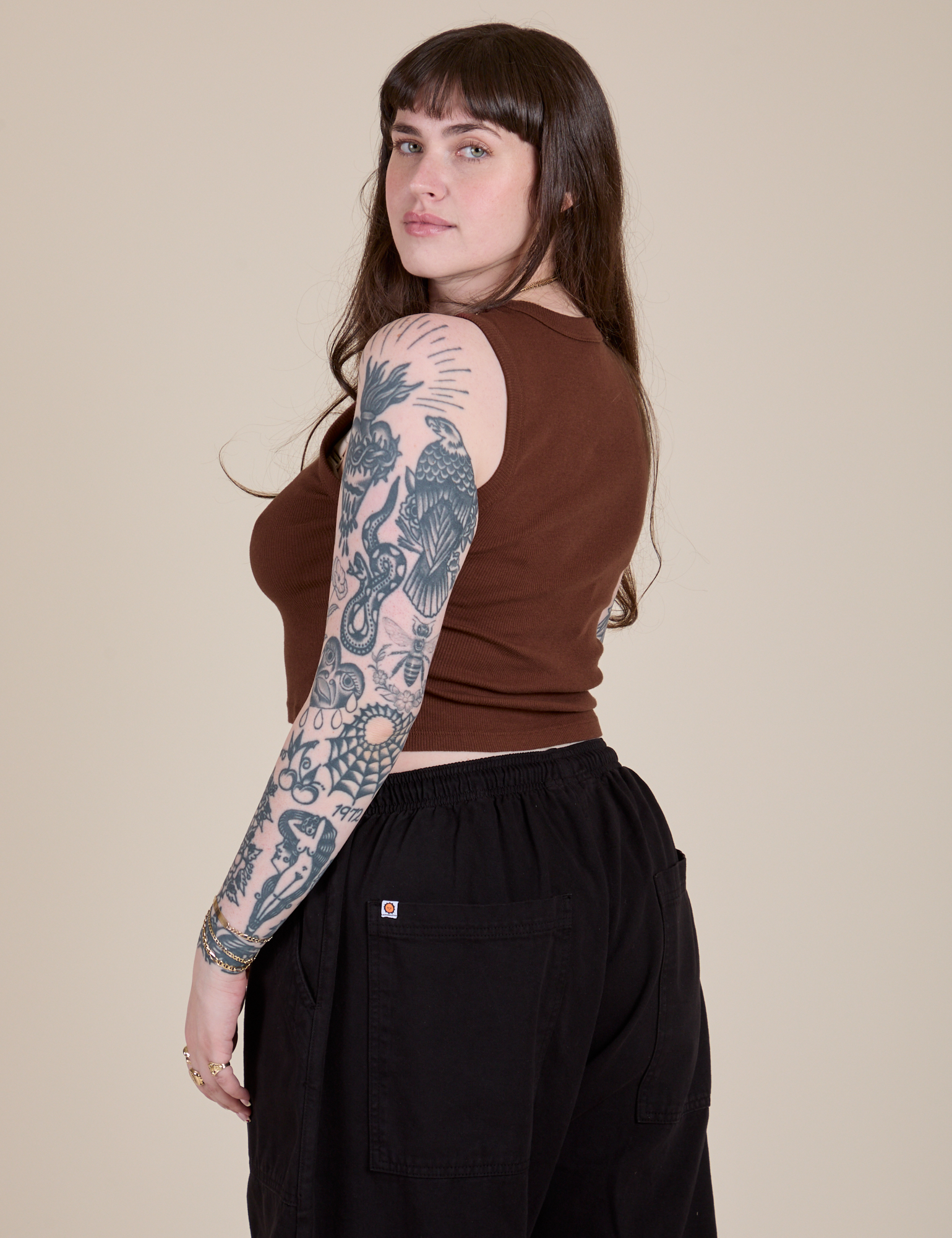 Angled back view of Muscle Tee in Fudgesicle Brown on Sydney