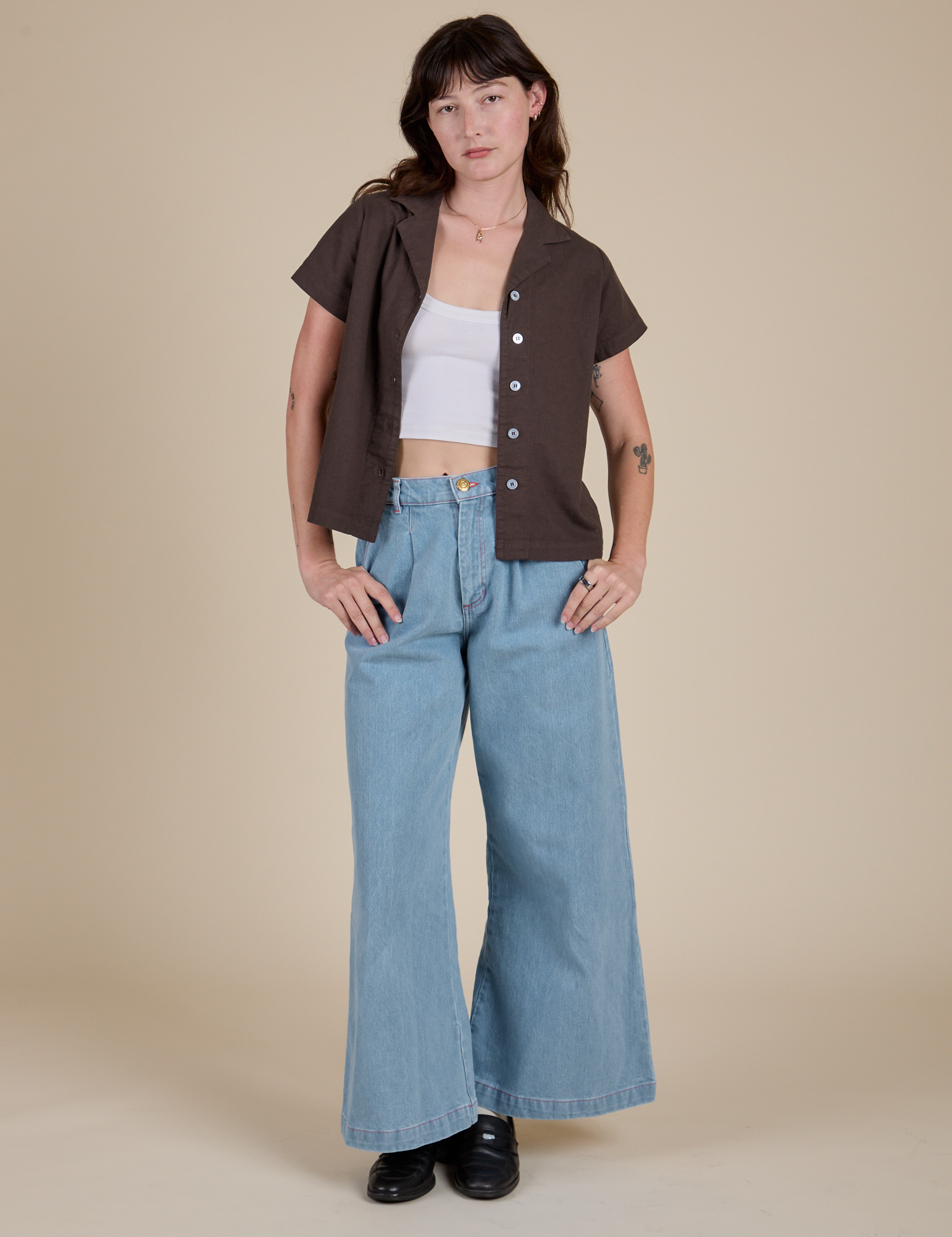 Alex is wearing Pantry Button-Up in Espresso Brown and light wash Indigo Wide Leg Trousers