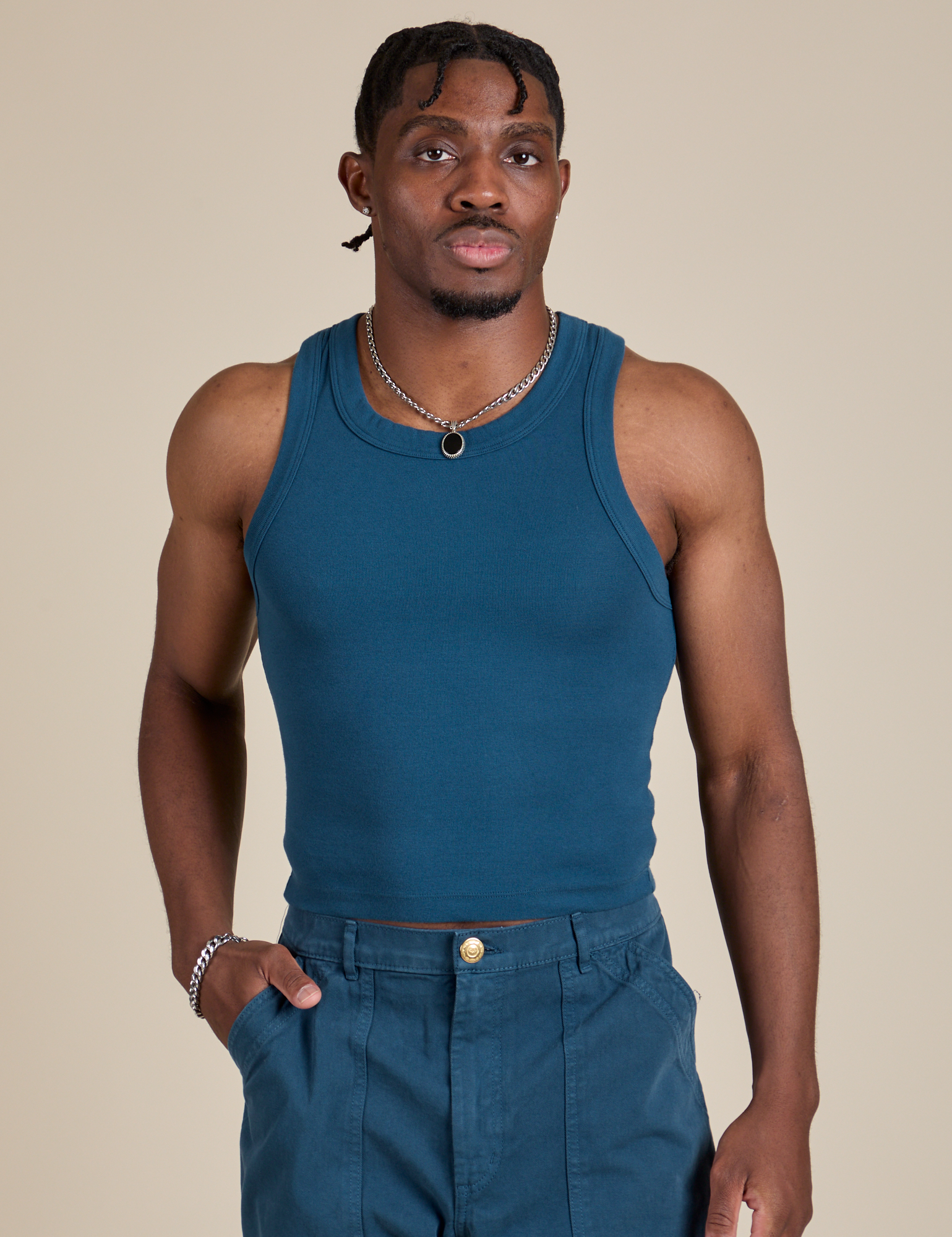 Isaac is 5’10” and wearing S Racerback Tank in Lagoon